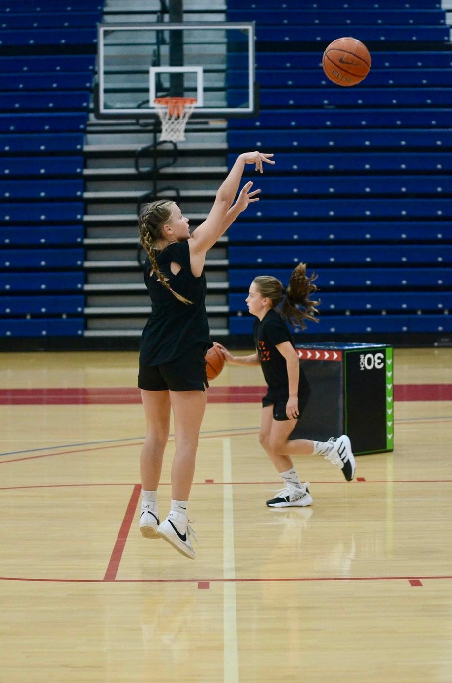A TC3 Basketball athlete rising up for a jump shot during training